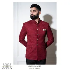 The crimson bandhgala, shown here with a pocket square, demonstrates its versatility. The rich, textured material catches the light beautifully, making it an exceptional choice for wedding receptions and formal celebrations.