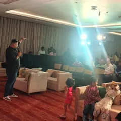 It's all about creating a connection. Here, our lead singer interacts with the audience, including the younger guests, making everyone feel like a part of the show at a private party.