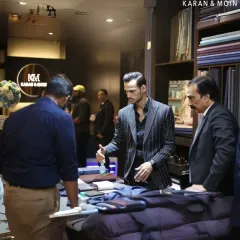 Legacy in motion, vision in action. This is my son, Kabir, at the helm, carrying forward our timeless philosophy. He is guiding a client through the fabric selection, ensuring the process is as personal as the final garment.