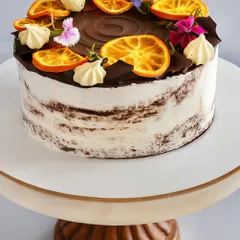 (Hero Media) This Chocolate Orange Naked Cake is one of my absolute favorites to make. It features a soft chocolate sponge, a rich orange-infused dark chocolate ganache, and just a light touch of whipped cream. The candied oranges and fresh flowers make it a beautiful centerpiece for any occasion.