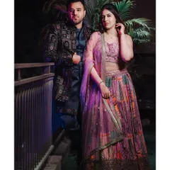 A full-length portrait of siblings Vipul and Vanshika posing together during the pre-wedding religious ceremony.
