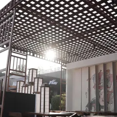 The Ebisu pop-up restaurant during the day, with sunlight filtering through the latticed wooden roof. This design element created beautiful shadow patterns and provided a semi-open-air feeling.