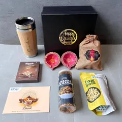 I also create custom hampers for festivals like Diwali. This set for Infosys combines a personalized bamboo travel mug with festive diyas, assorted snacks, and a branded greeting card, showing how we can mix practical items with seasonal treats.