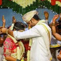A joyous moment as the couple is showered with turmeric-coated rice, a blessing of prosperity and happiness. We capture the action and emotion perfectly.