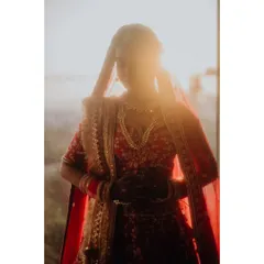 A dreamy, sun-flared portrait of the bride, creating a halo effect that makes her look absolutely ethereal.