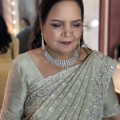 A close-up of the makeup for the mother of the bride, featuring soft, defined eyes and a flattering lip color.