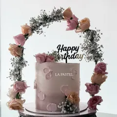 A closer look at the beautiful floral tiara cake. The combination of peach and pink roses with delicate baby's breath creates such a soft and romantic feel.