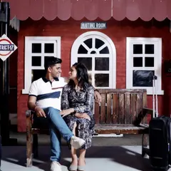 A candid shot on the railway station set, capturing a natural moment of conversation between the couple. This shows how we can mix posed and unposed shots within a single theme.