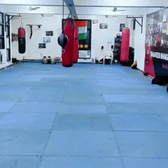 The training floor of our academy. We have ample space, matted floors for safety, and a variety of punching bags for all types of training.