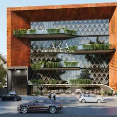 This is a 1000 sqm office building I designed for the IT hub in Gurgaon. The facade features a distinctive diamond-patterned glass curtain wall, framed by a bold terracotta-colored structure, with integrated green balconies to introduce nature into the corporate environment.