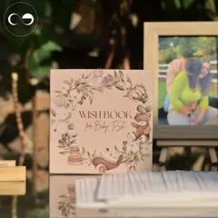 A custom "Wish Book" for guests to write messages for the baby. This beautiful keepsake, featuring whimsical woodland animals, was a central part of the interactive table at the storybook themed shower.