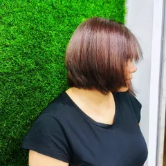 A side profile of my new summer haircut. A great hairstyle is the foundation of any look, and this sleek bob is a versatile and chic choice that complements many different styles.