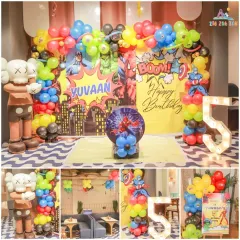 A closer look at a super celebration for Yuvaan's 5th birthday. We combine character backdrops, custom balloon columns, and light up marquee numbers to make the theme feel extra special.