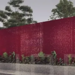 A rendering of our business hub project in Tiruppur, which uses composite panels made from recycled PET bottles. The bold red metal shell creates a landmark building for the textile industry, showcasing sustainable and affordable construction.