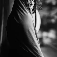 In monochrome, distractions fade away, revealing the soul's true expression. This fine art black and white portrait was created during a quiet, meditative session, allowing the subject's inner world to emerge through a simple, powerful gaze.