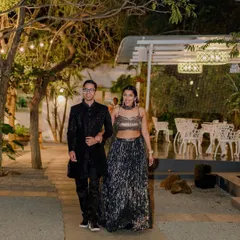 A stylish couple makes their entrance at their evening cocktail party. The ambient lighting of our venue creates a dramatic and romantic mood.