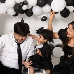 Family sessions are always full of fun. This playful moment from a cake smash shows the genuine laughter and connection we aim to capture when you bring the whole family to the studio.