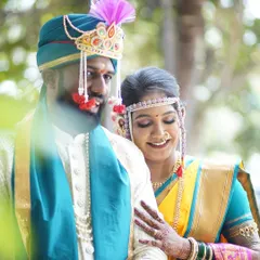 A beautiful candid of the couple, lost in their own world. The bride's makeup is soft and romantic, perfect for capturing these unscripted moments of love.