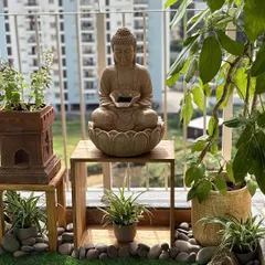 I can help you create a zen corner on your balcony, a perfect escape from the city buzz. This setup features a calming Buddha water fountain, hardy plants that love the sun, and natural stone details, all coming together to create a truly serene atmosphere.