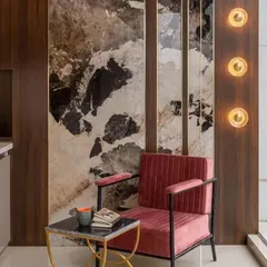 I love using materials in unexpected ways. Here, a large 8x4 foot tile that looks like abstract art becomes the feature wall for a cozy foyer corner. It’s a bold move that paid off, creating a stunning and unique first impression.