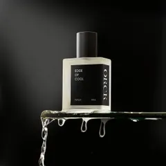 A minimalist yet powerful shot for 'Edge of Cool' perfume. The water dripping off the glass shelf creates a sense of freshness and edginess, perfectly matching the product's name.