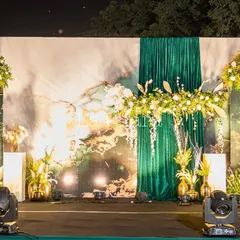 We designed this sophisticated stage for the Inditex corporate Diwali party. The setup features a custom-printed backdrop with marble and gold textures, elegant green draping, and lush floral arrangements, creating a luxurious and festive focal point for the evening's events.