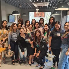 A full house of happy faces! This photo captures the incredible energy of our community. We are a group of women who seek to rise above the ordinary through the power of reading and connection.