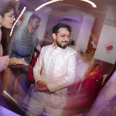 I love using creative techniques like a slow-shutter swirl to capture the dynamic energy of the Sangeet dance floor. It adds a fun, artistic blur of motion and color.