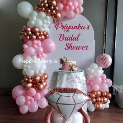 This is our classic bridal shower decoration, perfect for creating a feminine and celebratory atmosphere. The design includes a personalized arched backdrop, an organic balloon garland in pink, white, and rose gold, and a large diamond ring foil balloon for that perfect photo opportunity.