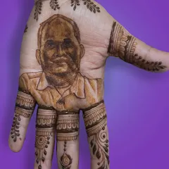 A client once joked she wanted to have her husband "in her grip," so I made it happen. This portrait was a fun and hilarious request that shows how personalized henna can be.