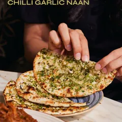 Our crowd-favourite Chilli Garlic Naan, generously topped with fresh garlic and herbs. It's the perfect partner for our slow-cooked Raan Musallam.