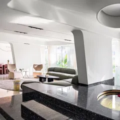 In Apartment 56, we explored the concept of fluid, gallery-like living. Inspired by land artists, we designed the interiors as a series of seamless, experiential spaces where sculptural columns, petal-like ceilings, and a reflective water feature merge art and architecture into a single, cohesive experience.