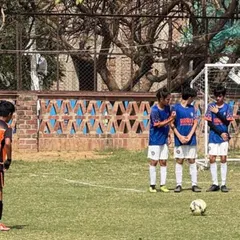 A U13 player lines up a free kick, showcasing the technical skills honed in our advanced training sessions.