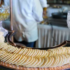 A beautiful arrangement of assorted crackers on a silver platter, part of our extensive grazing table spread. The focus is on quality ingredients and elegant presentation.