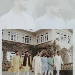 The groom and his groomsmen, all dressed in traditional attire, make a stylish entrance at the Haldi ceremony. This shot captures the energy and camaraderie of the groom's side.
