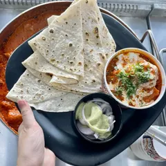 This is a full meal featuring my creamy Malai Chaap served with soft Rumali Roti. The chaap is cooked in a rich, cashew-based gravy and topped with cream, making it a hearty and flavourful option.