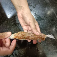 Each sausage is carefully wrapped by hand. This process ensures they hold their shape and cook evenly, locking in all the savory flavors.