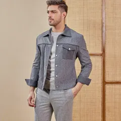 Monochrome, but never boring. This grey shacket with contrasting pocket details adds a playful edge to an understated look, making it perfect for the airport, an after-party, or dinner.