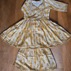 For your little girl who loves to twirl! This yellow and white Angarkha set is made from the softest cotton with just a hint of gold gota trim for that festive sparkle. It’s a traditional style made practical for modern kids who need to move.