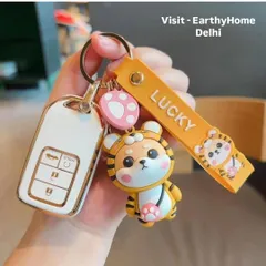 These keychains are a great way to accessorize keys or bags. Here's a lucky tiger keychain attached to a car key, showing its practical use and cute design.