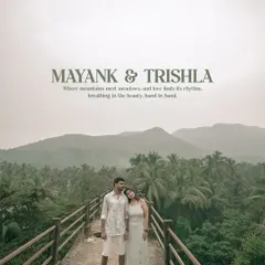 A stunning portrait of the couple on a bridge overlooking a lush valley of palm trees. This destination pre-wedding shot perfectly captures the feeling of love finding its rhythm in nature.