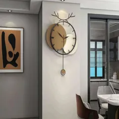 We combine modern art with functionality in this unique pendulum wall clock. Featuring a striking deer antler motif and contrasting metallic discs, it serves as both a reliable timepiece and a captivating piece of wall sculpture for any contemporary home.