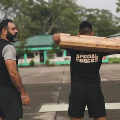 Our founder, Rishabh, observes a Special Forces soldier during a Samtola lift. We provide hands-on coaching to ensure our methods enhance their existing capabilities for tactical strength.