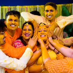 Haldi ceremonies are all about joyful chaos, and I am here for it. This moment, with everyone piling on the love (and haldi) for Neha, is pure, unfiltered happiness. I love capturing the energy when family and friends just let go and have fun.