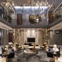 This view showcases the upper gallery overlooking the double-height living area in an Agra residence. The design uses vertical space to create a sense of openness and connection between the home's different levels.