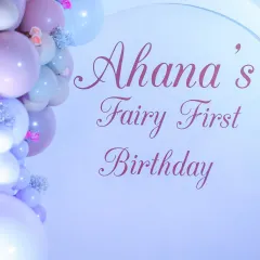A close-up of the signage for "Ahana's Fairy First Birthday," showcasing the elegant script and pastel color scheme perfect for a one-year-old's celebration.