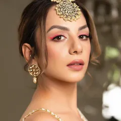 A pop of neon pink eyeliner is a fun and modern way to add color to your look. Paired with a nude lip and soft skin, it makes a bold yet chic statement.