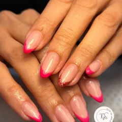 Who says a French manicure has to be boring? I gave this classic a fun twist with a vibrant hot pink tip and a surprise glitter accent nail. It's all about making the style your own.