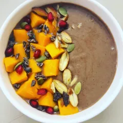 This sumptuous Choco Banana Smoothie is packed with the goodness of banana, dates, mango, and cacao. Topped with nuts and cacao nibs, it's an instant mood and energy booster.