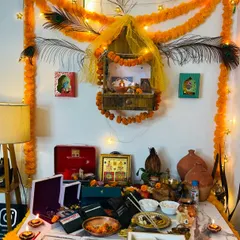 My Diwali puja setup at home, decorated with marigold garlands, peacock feathers, and lots of diyas. Creating a beautiful and spiritual corner for festivals is a special part of making a home feel personal and blessed.